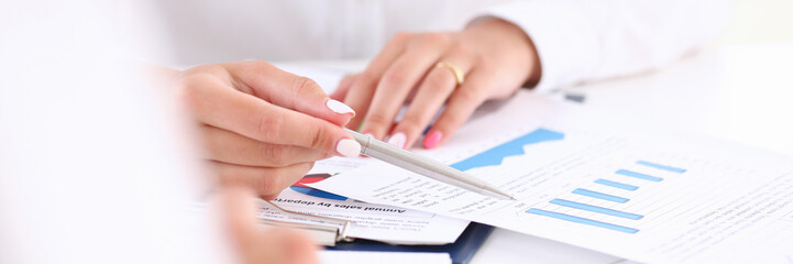 Businesswoman holding a silvery pen