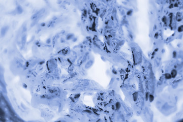 HeLa cervical cancer cells stained with Coomassie Blue under a microscope.