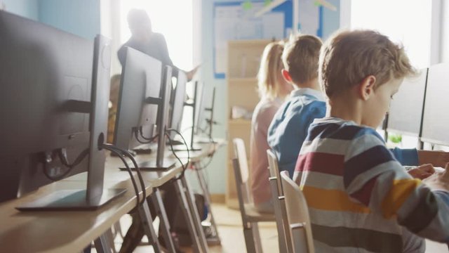 School Computer Science Classroom: Diverse Group of Smart Schoolchildren Have Fun while using Personal Computers, Learn Informatics, Internet Safety, Programming Language for Software Coding