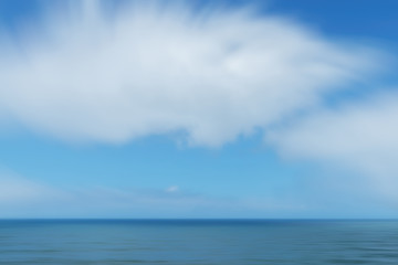 Dreamy, blurry sea with cloudy sky.