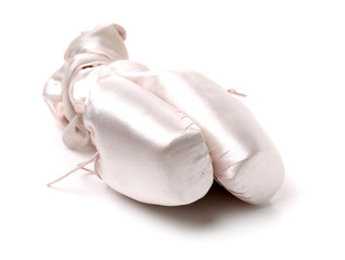 Ballet pointe shoes on white background
