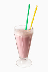 Strawberry milkshake in a glass with straws. Isolated over white background. Vertical.