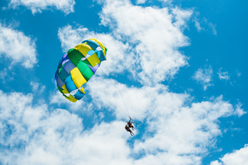 Parasailing, sunny day with white scattered clouds, Mexico