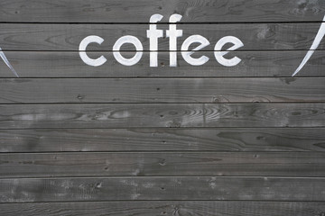 word coffee on gray wooden background