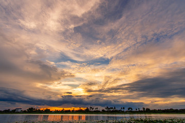 Fototapeta premium Panorama Sunlight with dramatic sky. sunset on dark background.Vivid orange cloud sky.