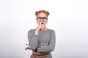 Portrait of cute smiling young woman in black dress putting hand prop up on chin isolated on white wall background in studio. People sincere emotions, lifestyle concept.