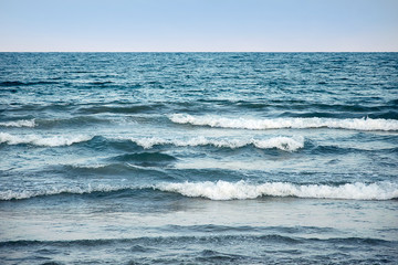 Blue sea water surface on sky