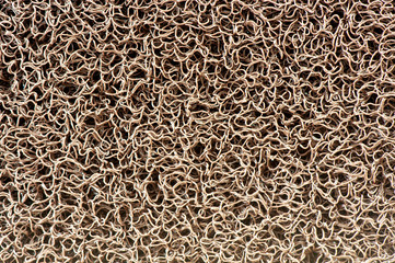 Close up of Vinyl dust trap carpet texture background. Abstract background concept for pattern and design. Industrial Yellow vinyl carpet Coil Pattern Car Floor Mat texture. anti slippery surface