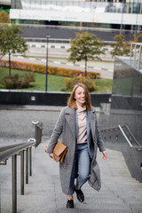  young girl in a business suit on the stairs