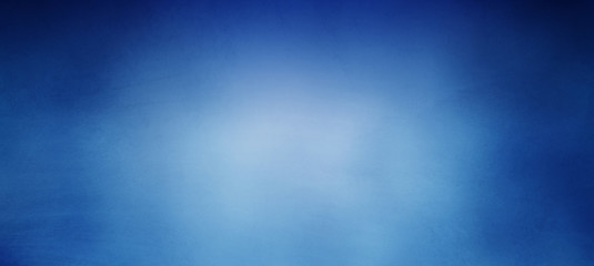 Old blue background with distressed streaks of vintage texture and dark border grunge