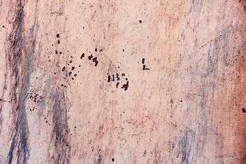 Texture of a concrete wall with cracks and scratches which can be used as a background