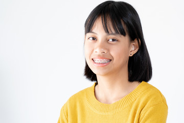 Girl with braces teeth smiling and happy