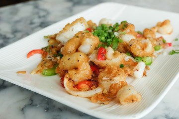 Fried squids or octopus (calamari) with chilli and garlic