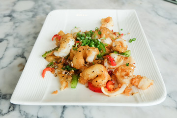 Fried squids or octopus (calamari) with chilli and garlic