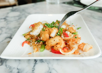 Fried squids or octopus (calamari) with chilli and garlic