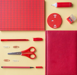 Flat lay red and white office supplies on a yellow background. Notebook, pen, kakrndash, paper clip, planer and corrector. Geometry