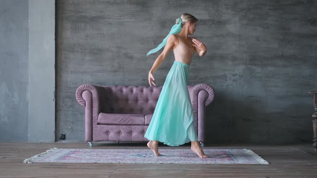 slow motion graceful woman dancing ballet in the hall