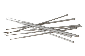 Strewn many gray sparklers, bengal lights on aluminum stick isolated on white background without shadow. Top view
