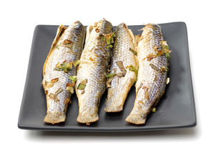 Hot fresh grilled grey mullet on white background