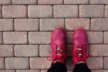 hiking travel backpacking world tourism walking old pinky pink purple shoes boots on the asphalt feet