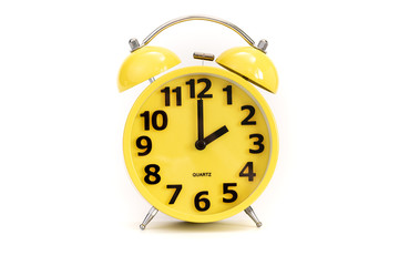 Yellow alarm clock on white at 2 o'clock
