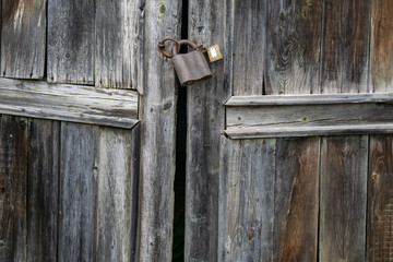 Padlock on an old door
