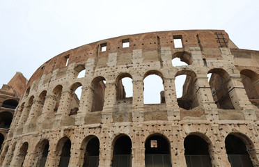 Naklejka premium Colosseum in Rome and many holes in the walls made to recover th