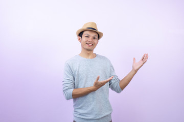 Happy asian  man action on  pink  background.