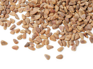 Pile of pine nuts on white background