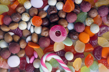 colorful bright assorted sweets and candy for kids party on white table