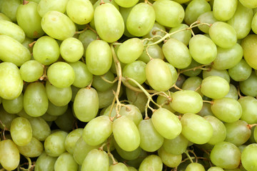 Closeup fresh green grape fruit at fruit market - green patterns