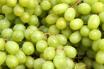 Closeup fresh green grape fruit at fruit market - green patterns