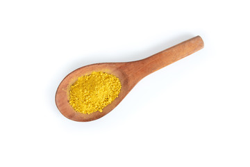 Yellow scrubbing powder in wooden ladle, concept of beauty and skin care