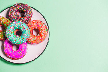 Group of glazed donuts on background