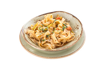 Pasta fettuccine with salmon on grey plate isolated on a white background