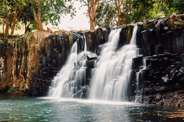 Rochester Falls in Mauritius. Cascade waterfall and beautiful black stone