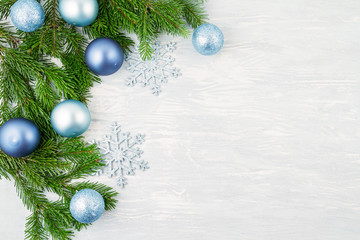 Obraz na płótnie Canvas Festive christmas background with blue and silver xmas decoration and xmas tree