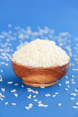 natural fresh white round rice in a decorative wooden plate
