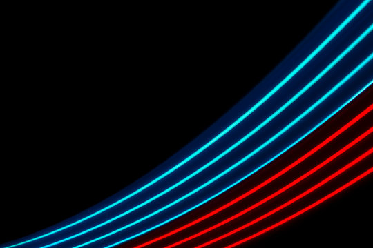 Red And Blue Light Dynamics Lines On A Black Background .