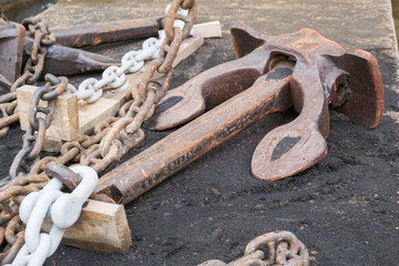anchor chain and the anchor is in the dock