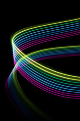 magenta, blue and yellow light dynamics lines on a black background .