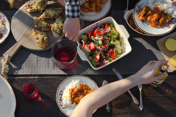 Healthy family  food lunch, top view.  dinner table, people eat healthy food. Salad, rice, tart cake, vegetables on a wooden background.