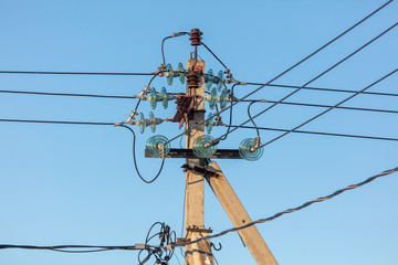 Electric pole against the blue sky