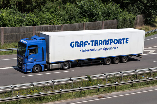 WIEHL, GERMANY - JUNE 24, 2019: Graf-Transporte MAN TGX truck with box trailer on motorway.