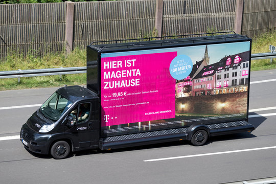 WIEHL, GERMANY - JUNE 25, 2019: Innovisco CoolLiteTruck with Deutsche Telekom advertising on motorway.