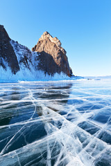 Winter landscape of frozen Baikal Lake. Famous Cape Khoboy - natural landmark of the Olkhon Island....
