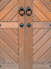 Old wooden gate with forged handles