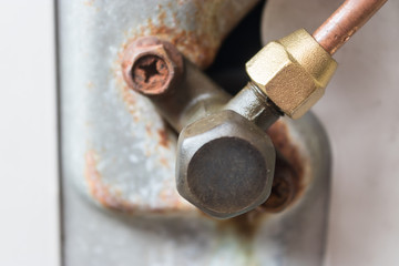The air conditioner has leaks  of refrigerant and water