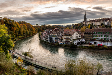 Panoramic view of the Bern old town with the Aare river flowing around the town at sunset in Bern, Switzerland