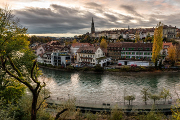 Panoramic view of the Bern old town with the Aare river flowing around the town at sunset in Bern, Switzerland